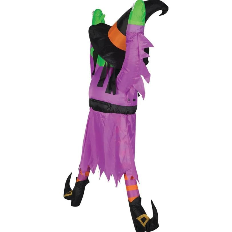 Colorful Halloween witch costume with purple dress, green hat, and black shoes on a white background