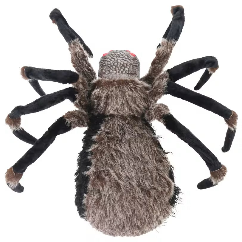 A realistic plush tarantula toy with a fuzzy brown and gray body and black legs, shown against a plain white background.