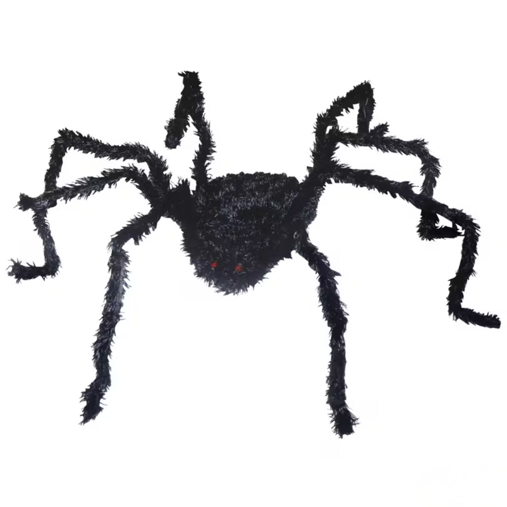 A black fuzzy spider decoration with small red eyes, isolated on a plain white background.