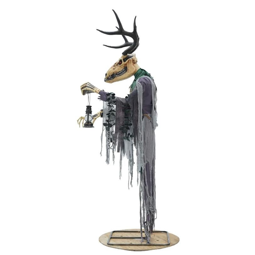 Decorative figure with a skull head and antlers holding a lantern on a white background