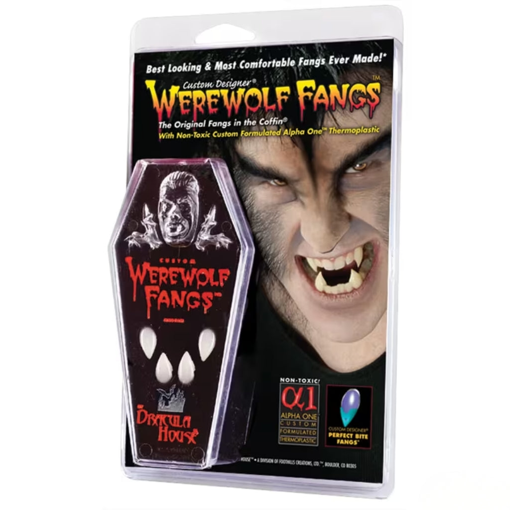 Packaged coffin-shaped werewolf fangs prop on a white background. The product is shown in its retail blister packaging with a printed backing card featuring the brand name Werewolf Fangs and a close-up of a werewolf face.