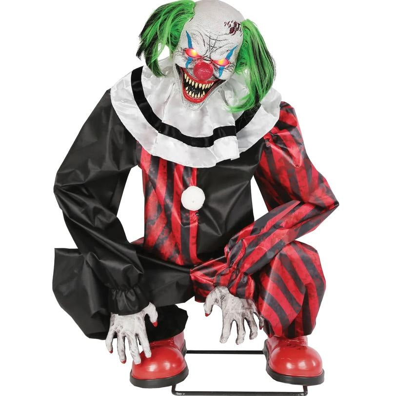 Horror clown figure with green hair, red and black outfit, and white face on a white background