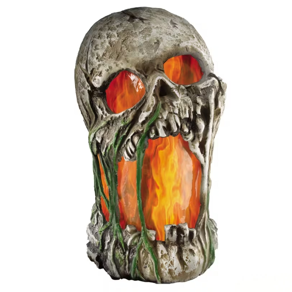 A skull-shaped decorative container or candle holder with a textured gray stone-like finish and glowing orange and yellow flame-like eyes and mouth, set against a plain white background.