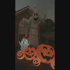 Video of inflatable Halloween Pumpkins in front of 2 inflatable ghosts sitting on a house front lawn